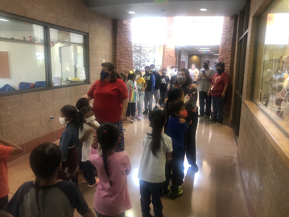 Teachers lead students down the hall